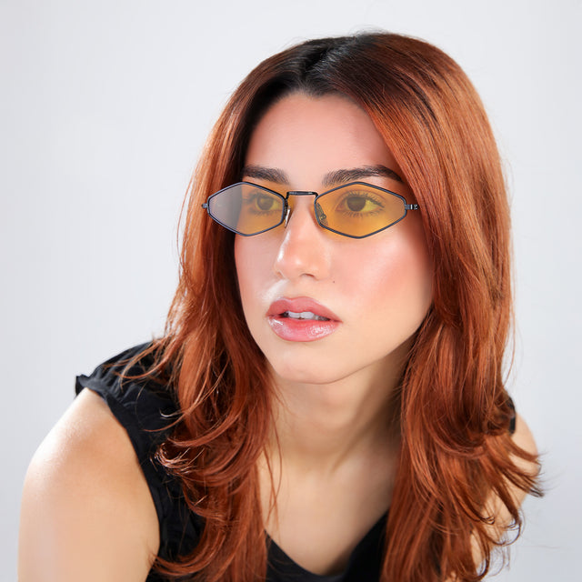 Woman with red hair wearing Astoria Sunglasses Black with Honey Flat See Through