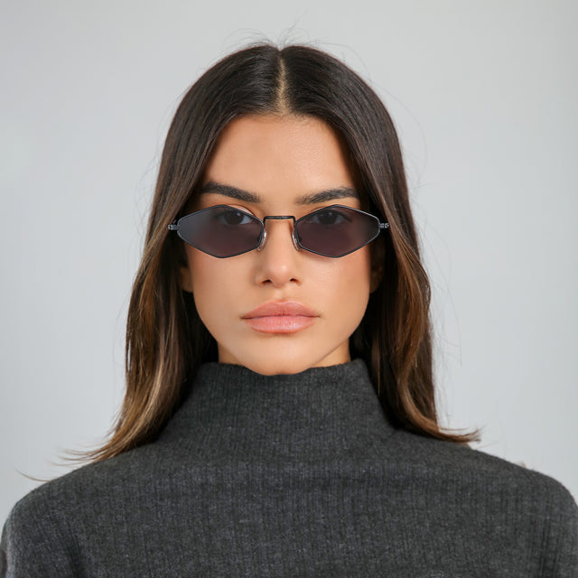 Woman with brown hair in a black cashmere turtleneck wearing Astoria Sunglasses Matte Black with Grey Flat