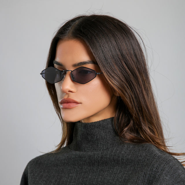 Another angle of woman with brown hair in a black cashmere turtleneck wearing Astoria Sunglasses Matte Black with Grey Flat