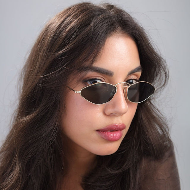 Another angle of brunette woman looking right wearing Austria Sunglasses Gold with Grey Flat
