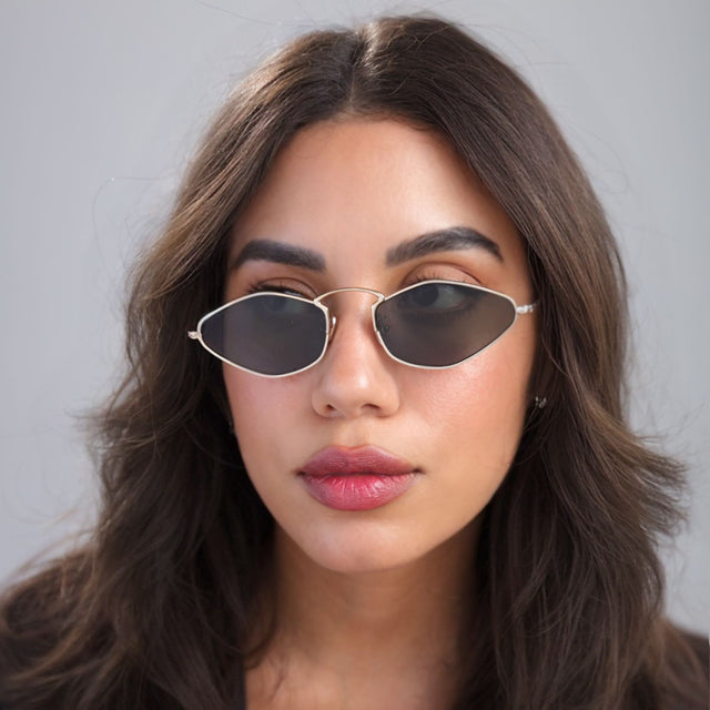 Brunette woman looking right wearing Austria Sunglasses Gold with Grey Flat