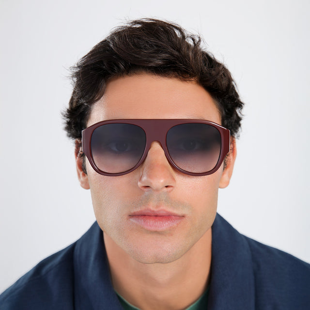 Another angle of man in a navy jacket wearing Colorado Sunglasses Bordeaux with Grey Gradient