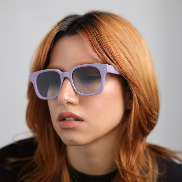 Model with red hair wearing Ellison Sunglasses Matte Lavender with Olive Flat Gradient