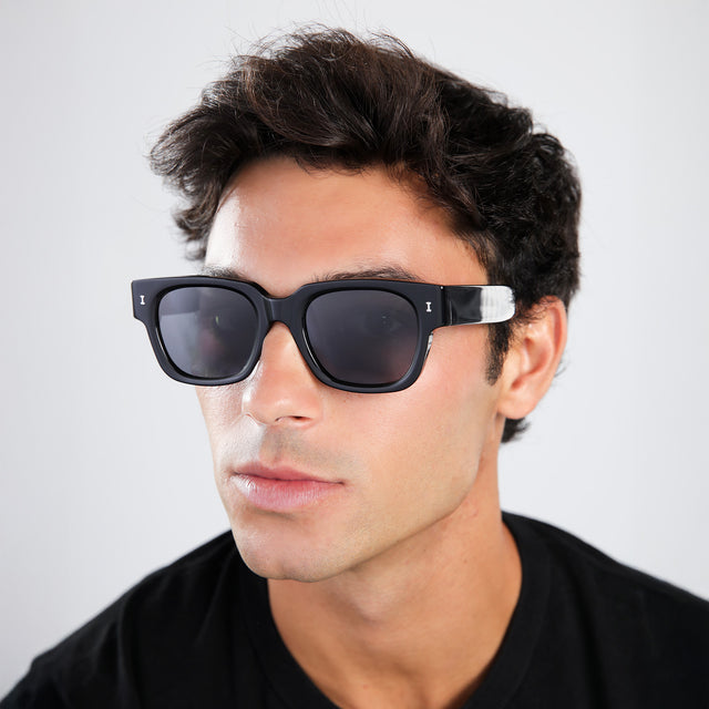Close up of man in a brown shirt wearing Francesco Sunglasses Black with Grey