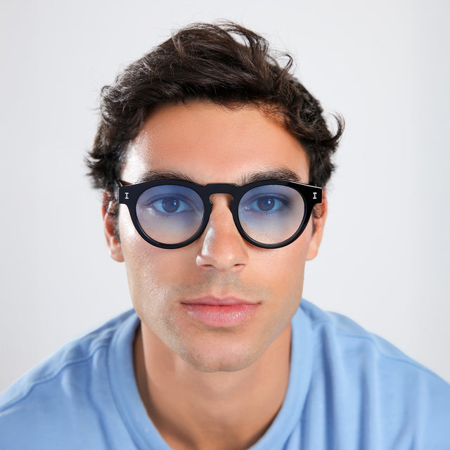 Another angle of man with brown hair in a baby blue shirt wearing Leonard Sunglasses Black with Blue Gradient See Through