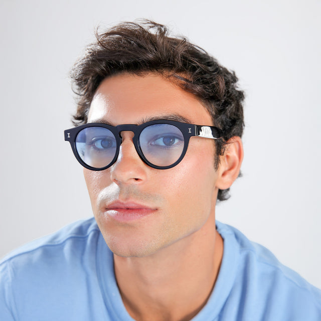 Man with brown hair in a baby blue shirt wearing Leonard Sunglasses Black with Blue Gradient See Through