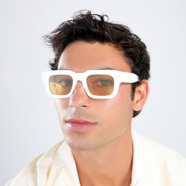 Another angle of man with brown hair in a pastel linen shirt wearing Lewis 50 Sunglasses White with Honey Flat See Through