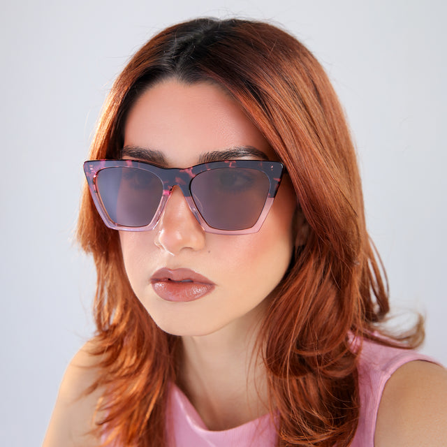 Woman with red hair in a pink blouse Lisbon Sunglasses side view in Cherry Blossom / Brown