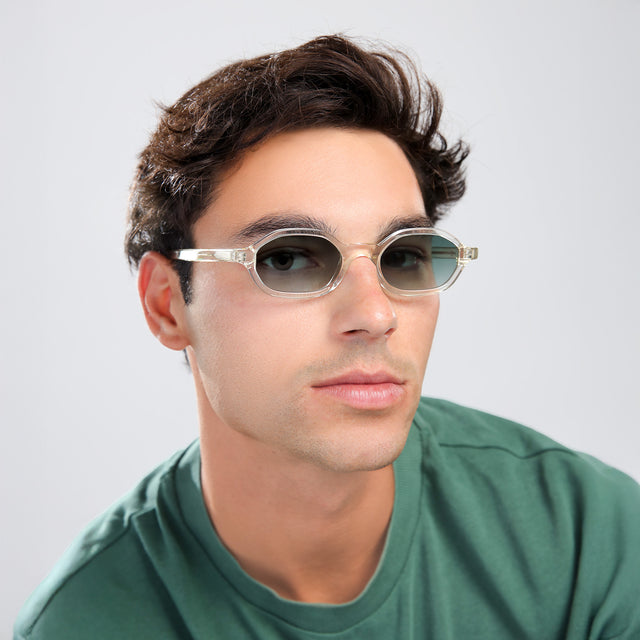 Another angle of man with brown hair in a green shirt wearing Munich Sunglasses Champagne with Olive Flat Gradient