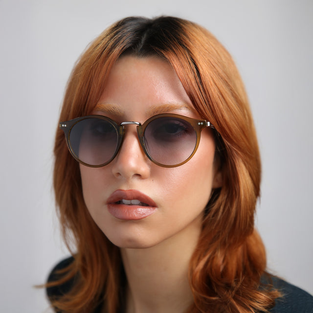 Another angle of model with red hair wearing Portofino Sunglasses Moss with Grey Gradient