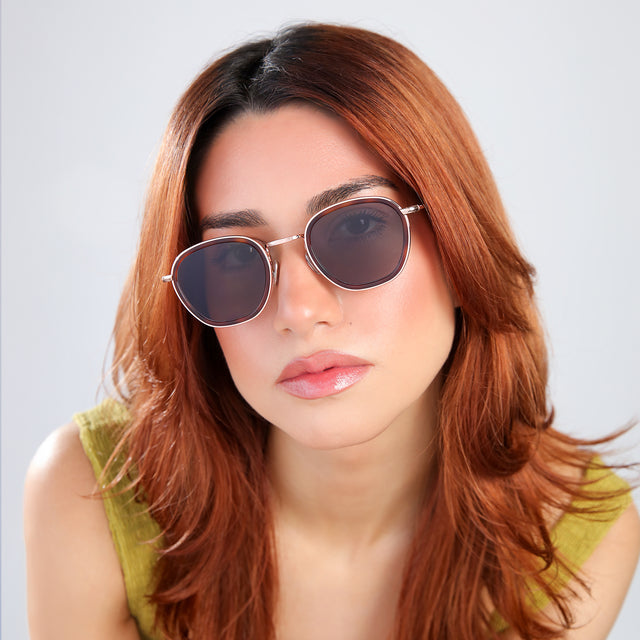 Close up of woman with red hair in a chartreuse blouse wearing Prince Tate Sunglasses Havana/Rose Gold with Grey Flat