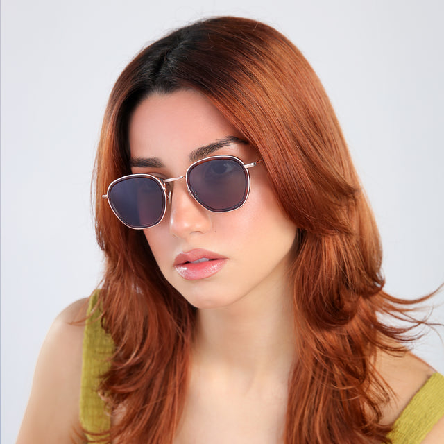 Another angle of woman with red hair in a chartreuse blouse wearing Prince Tate Sunglasses Havana/Rose Gold with Grey Flat