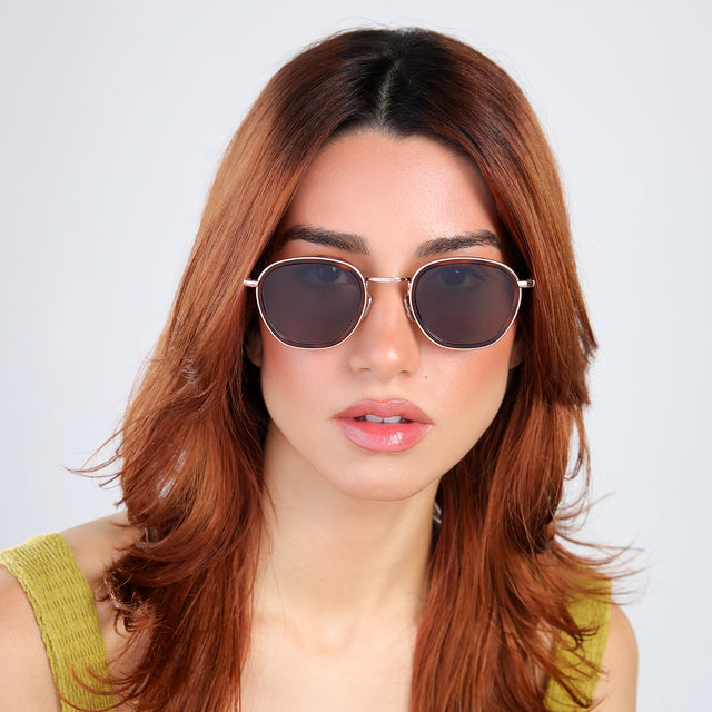 Woman with red hair in a chartreuse blouse wearing Prince Tate Sunglasses Havana/Rose Gold with Grey Flat