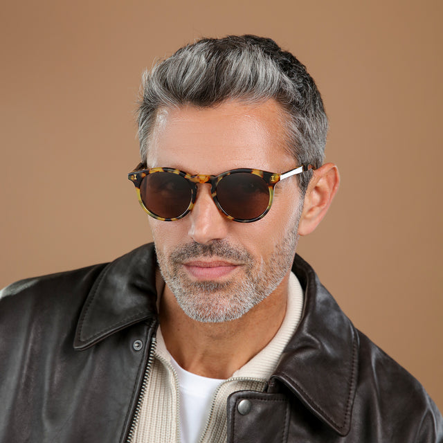 Another angle of man in leather jacket wearing Sterling Sunglasses Tortoise with Brown Flat