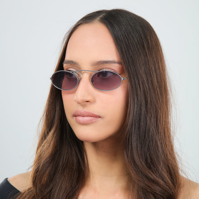 Woman with brown hair in an off-the-shoulder blouse wearing Sydney Sunglasses Gunmetal with Grey Gradient
