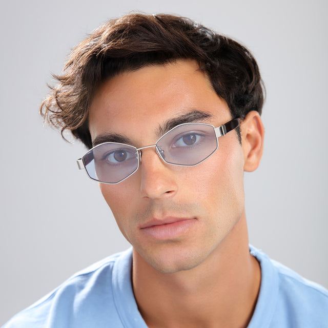 Man in a baby blue tee wearing Tucson Sunglasses Silver/Havana with Light Blue See Through