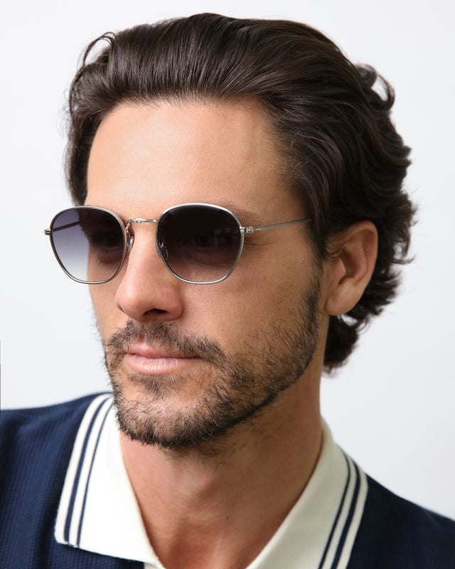 Model with semi short brown hair wearing Prince Sunglasses Silver with Grey Flat Gradient