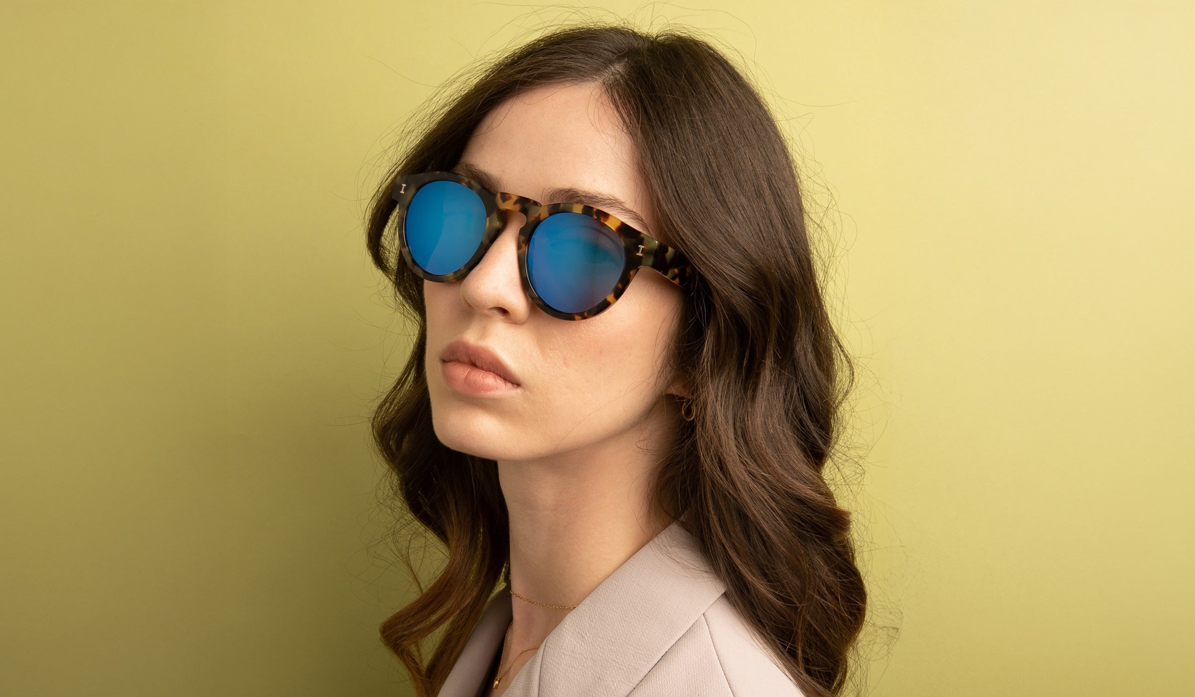 Model wearing Leonard Sunglasses in Tortoise with Blue Mirror