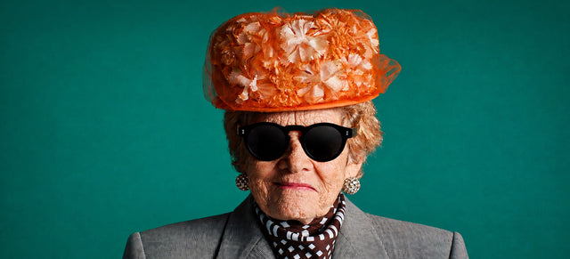 Woman in a large hat wearing the Leonard in Black