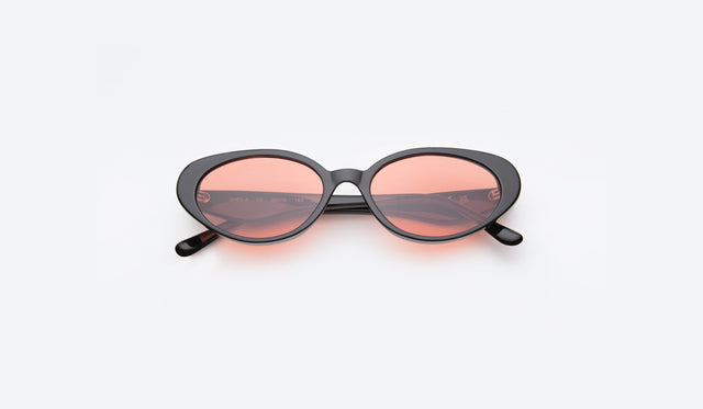 Sheila shown in Black with Sunset lenses on a white counter