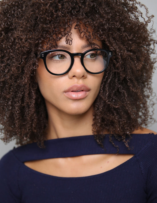 Woman with curly hair wearing the Atlantic eyeglasses in Black