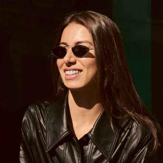 Woman in Paris wearing Austria Sunglasses Gold with Grey Flat