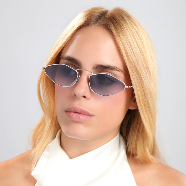 Blond woman in a white silk halter wearing Austria Sunglasses Silver with Midnight Blue Flat Gradient