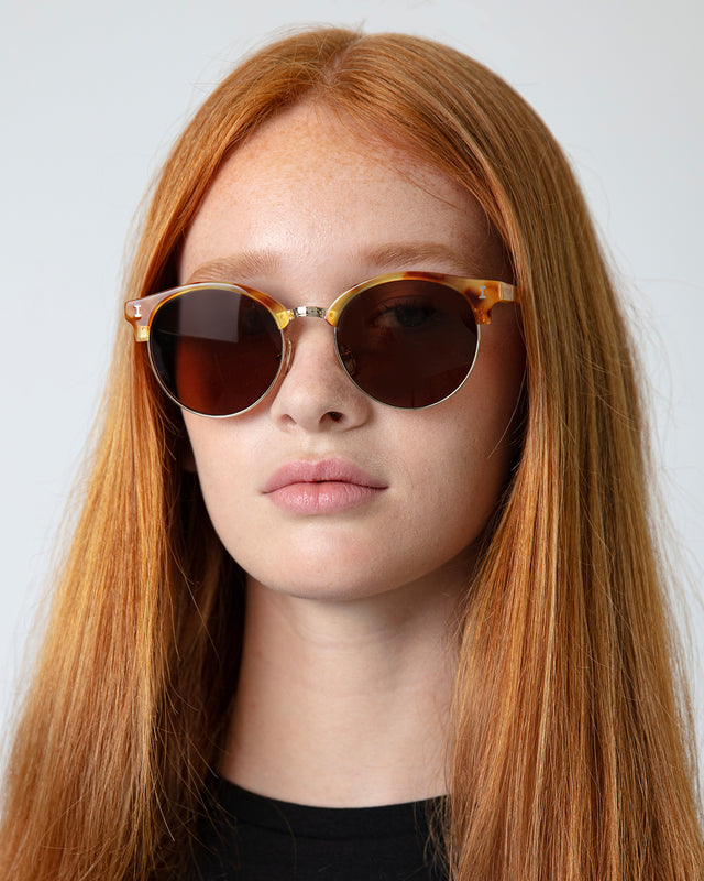 Model with straight red hair wearing Benson Sunglasses Amber/Gold with Brown