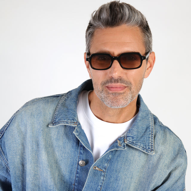 Model with salt and pepper hair and beard wearing Berlin Sunglasses Black with Brown Gradient