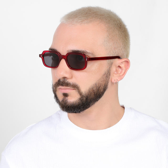 Bearded model looking right wearing Berlin Sunglasses Mulberry with Grey