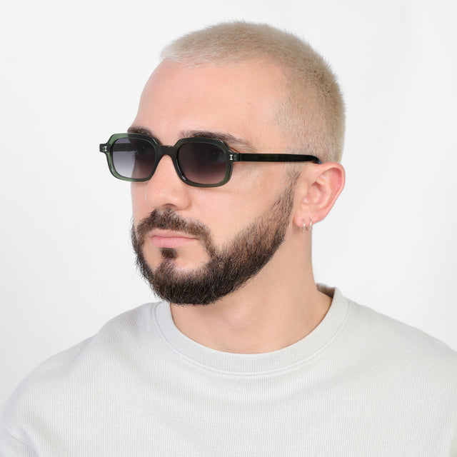 Bearded model looking right wearing Berlin Sunglasses Pine with Grey Gradient