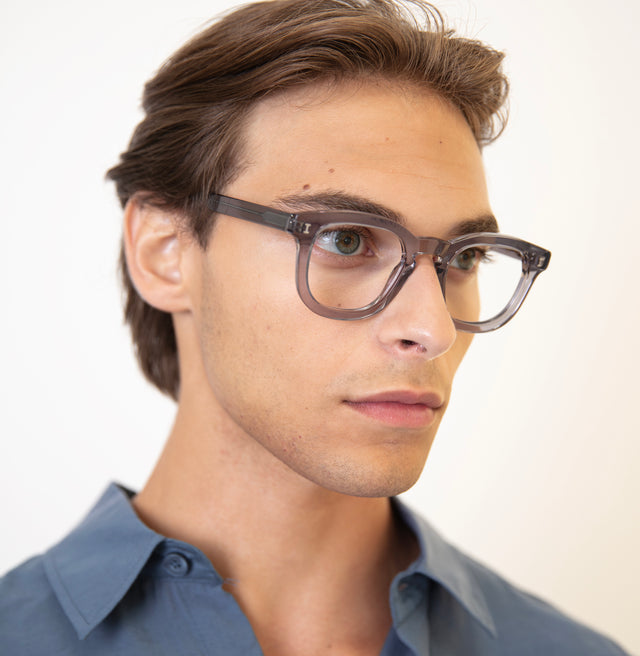 Angled pose of model with pushed back hair wearing Boston Optical Mercury Optical