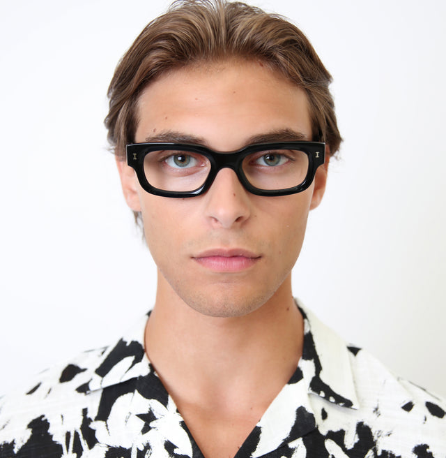 Model with light brown hair wearing Cali Optical Black Optical