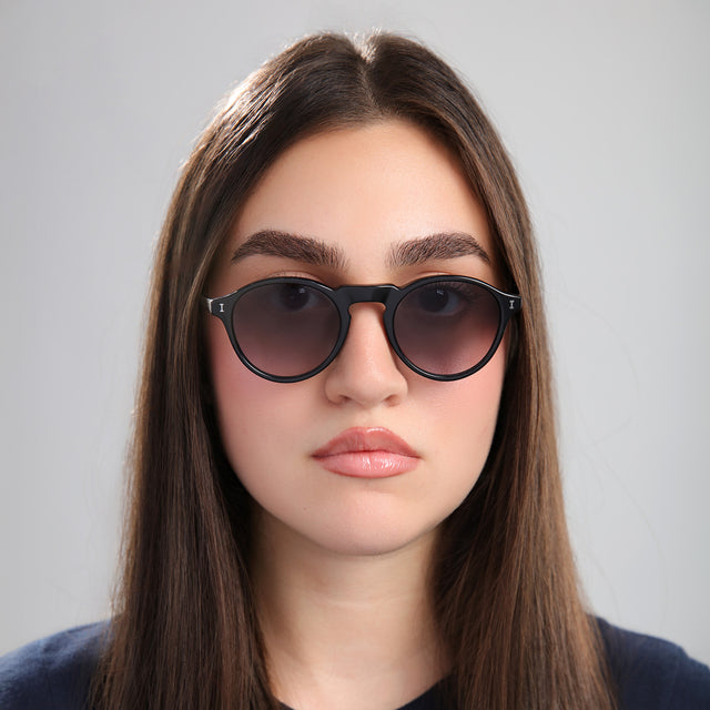 Brunette woman wearing Capri Sunglasses Black with Grey Gradient