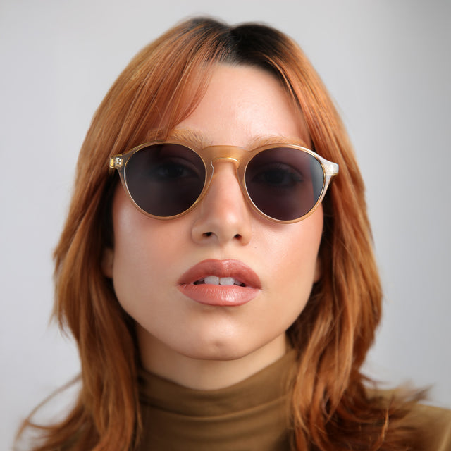 Model with red hair wearing Capri Sunglasses Citrine with Grey