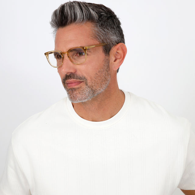 Model with salt and pepper hair and beard wearing Copenhagen Optical Citrine Optical