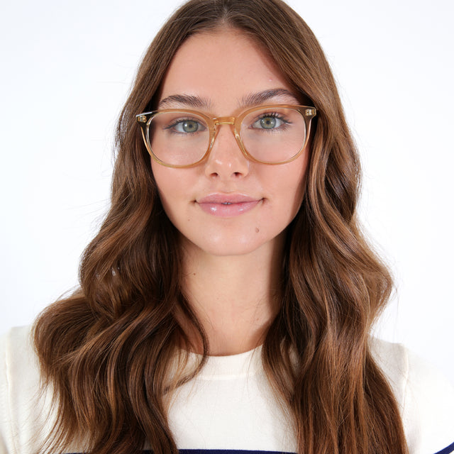 Brunette model with loose curls wearing Copenhagen Optical Citrine Optical