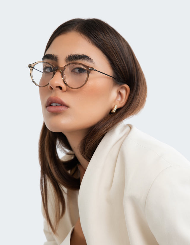 Woman in a white blazer wearing the Dana Optical