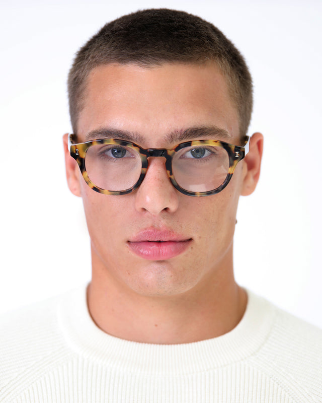 Model with buzzcut wearing Delray Optical Tortoise Optical