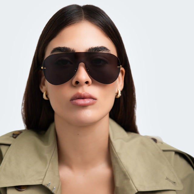 Woman in a trench coat wearing Douglas Mask Sunglasses Grey with Grey