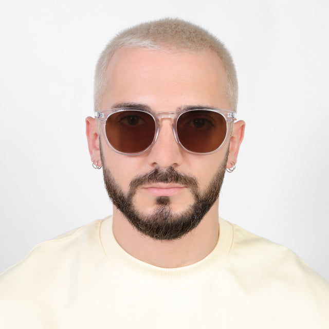 Model with platinum buzzcut wearing Eldridge 56 Sunglasses Clear with Brown Flat