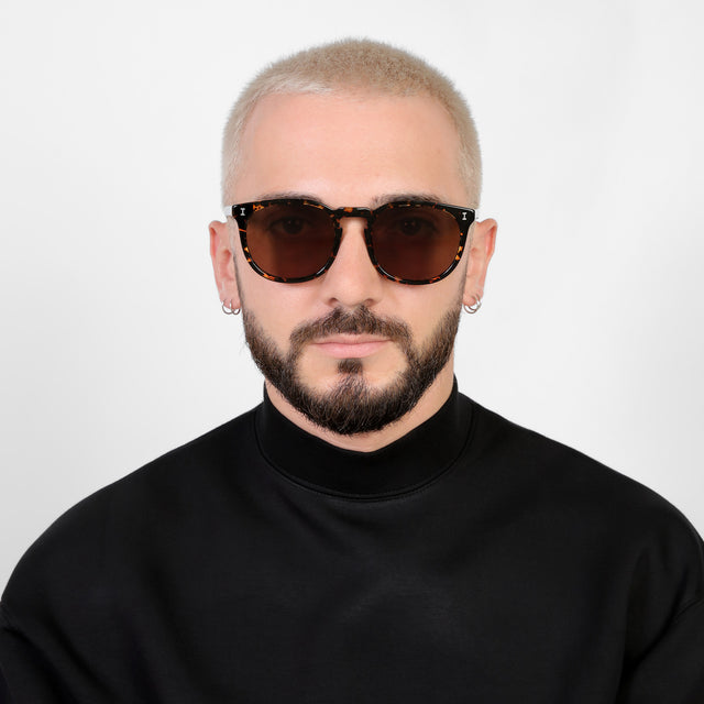 Model with platinum buzzcut wearing Eldridge 56 Sunglasses Flame with Brown Flat