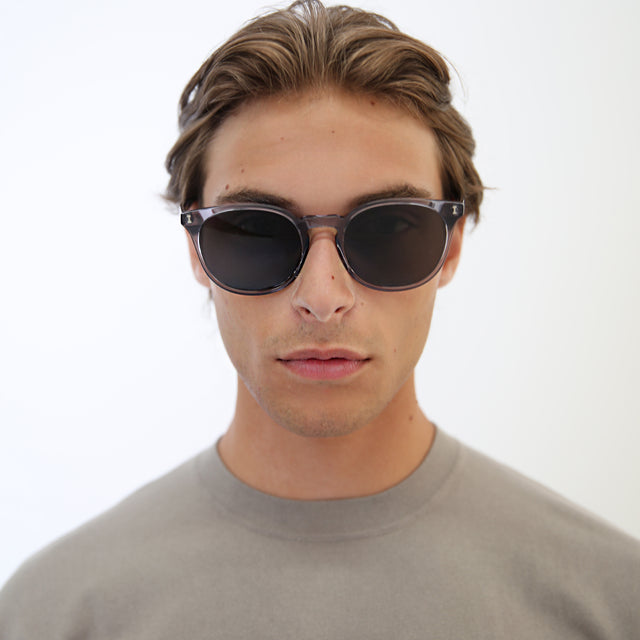 Model with light brown hair combed back wearing Eldridge 56 Light Sunglasses Mercury with Grey Flat