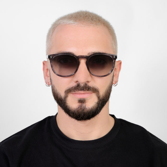 Model with platinum buzzcut wearing Eldridge 56 Sunglasses Onyx with Grey Flat Gradient