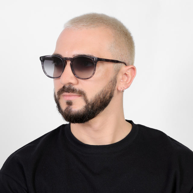 Bearded model looking right wearing Eldridge 56 Sunglasses Onyx with Grey Flat Gradient