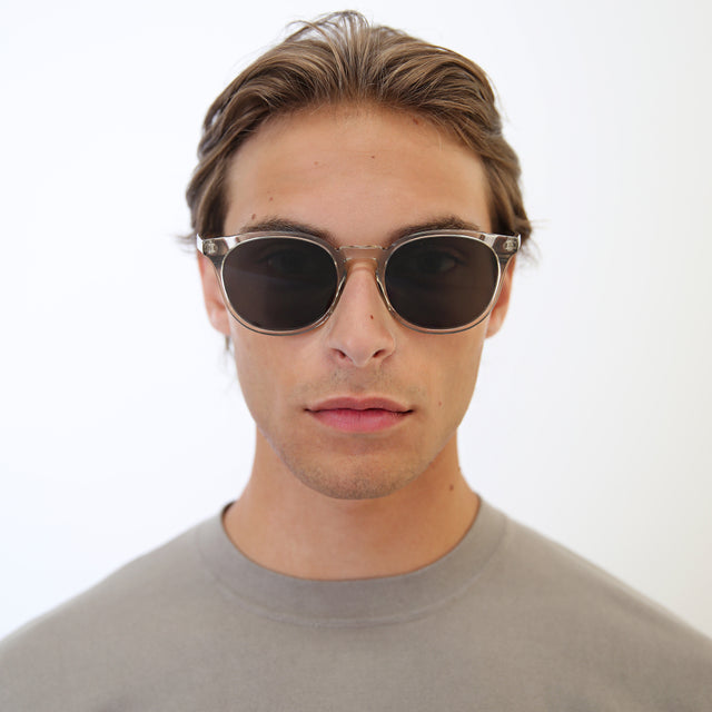 Model with light brown hair combed back wearing Eldridge 56 Light Sunglasses Cool Grey with Grey Flat