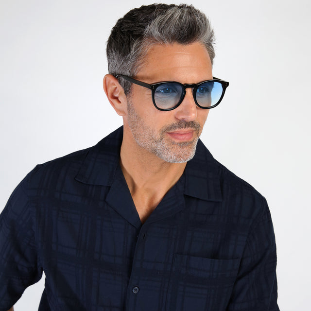 Model with salt and pepper hair and beard wearing Eldridge Sunglasses Black with Blue Flat Gradient See Through