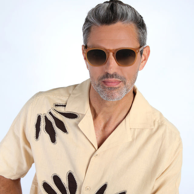 Model with salt and pepper hair and beard wearing Eldridge Sunglasses Matte Honey with Olive Flat Gradient