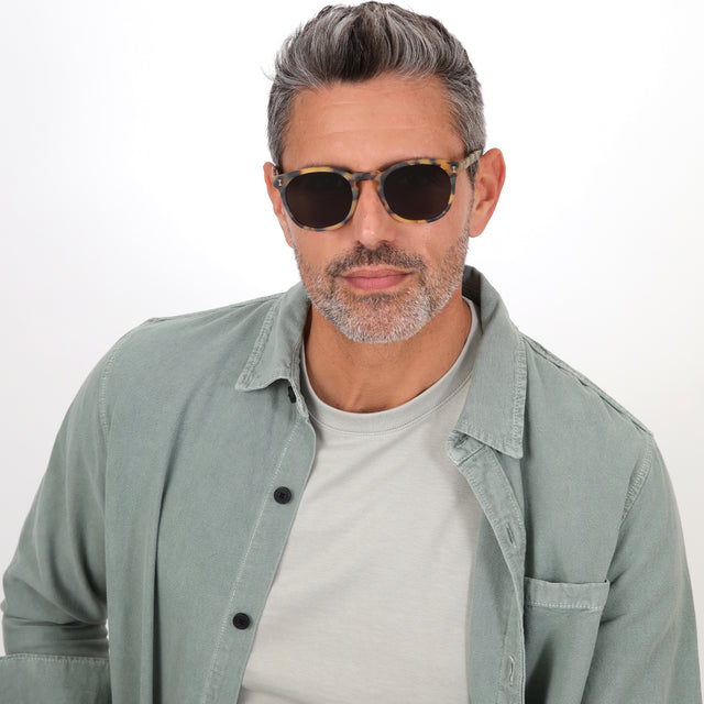 Model with salt and pepper hair and beard wearing Eldridge Sunglasses Matte Tortoise with Grey Flat