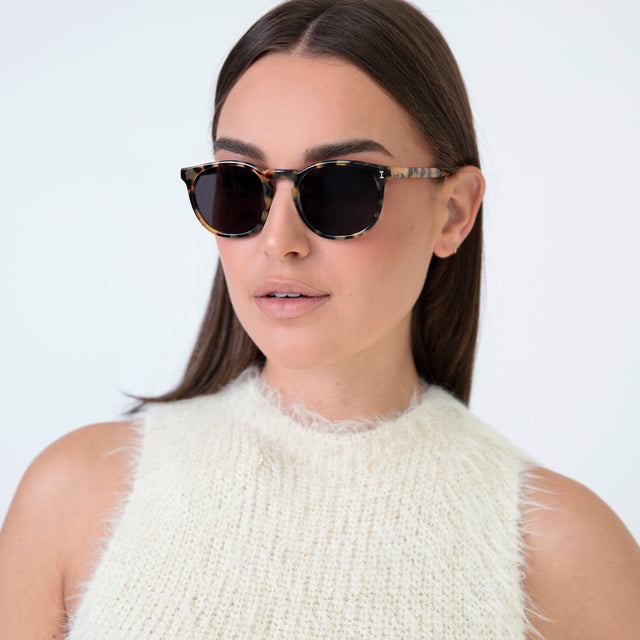 Brunette model with straight hair wearing Eldridge Sunglasses Tortoise with Grey Flat